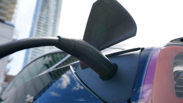 An electric vehicle is charged in Ottawa on Wednesday, July 13, 2022. THE CANADIAN PRESS/Sean Kilpatrick
