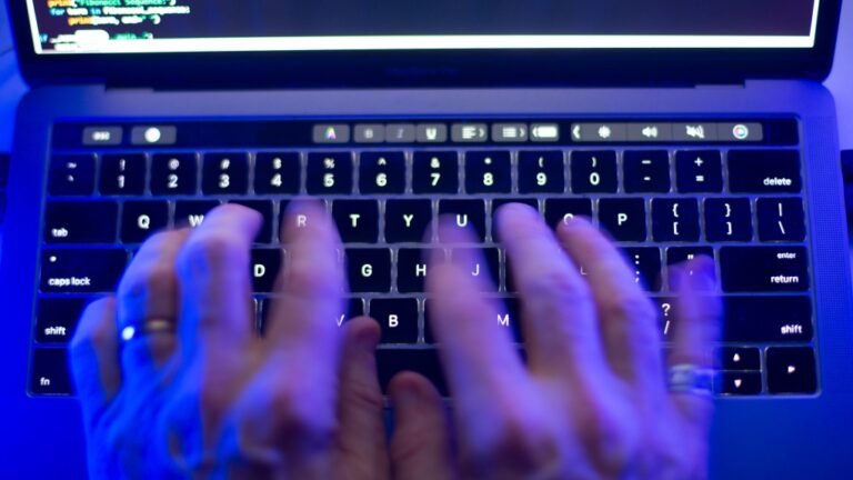 A man uses a computer keyboard in Toronto on Monday, Oct. 9, 2023 in this photo illustration. THE CANADIAN PRESS/Graeme Roy