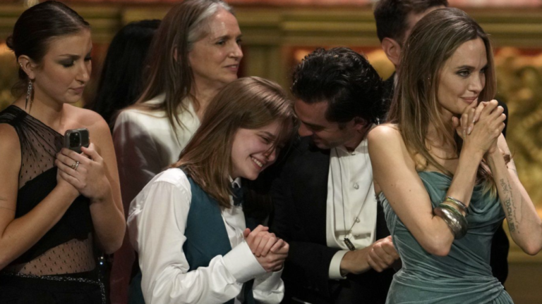 Vivienne Jolie-Pitt, from left, Justin Levine, Angelina Jolie, and members of the company of 'The Outsiders' during the 77th Tony Awards on Sunday, June 16, 2024, in New York. (Photo by Charles Sykes/Invision/AP)