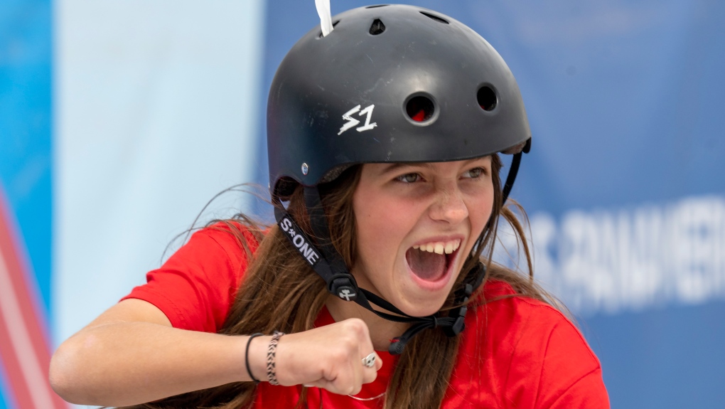 Canada's Fay De Fazio Ebert celebrates during her gold medal performance, while wearing on feather from her pet duck in her helmet, at the Women's Park Skateboarding at the Pan American Games in Santiago, Chile on Oct. 22, 2023. (Frank Gunn/The Canadian Press)