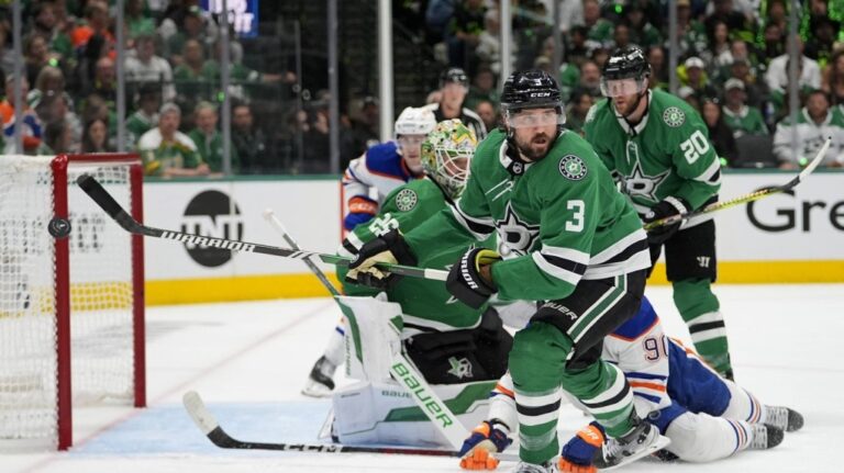 Dallas Stars defenseman Chris Tanev (3) clears the puck during an attack from the Edmonton Oilers during the second period of Game 5 of the Western Conference finals in the NHL hockey Stanley Cup playoffs, in Dallas, Friday, May 31, 2024. THE CANADIAN PRESS/AP-Julio Cortez
