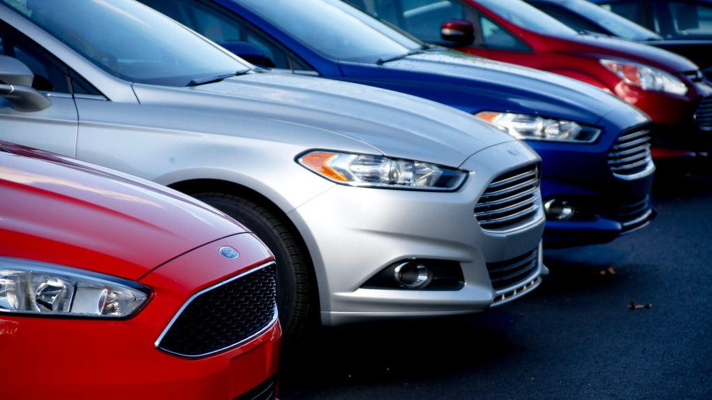 In this Thursday, Nov. 19, 2015, file photo, a row of new Ford Fusions are for sale on the lot at Butler County Ford in Butler, Pa. (Keith Srakocic / AP Photo, File)