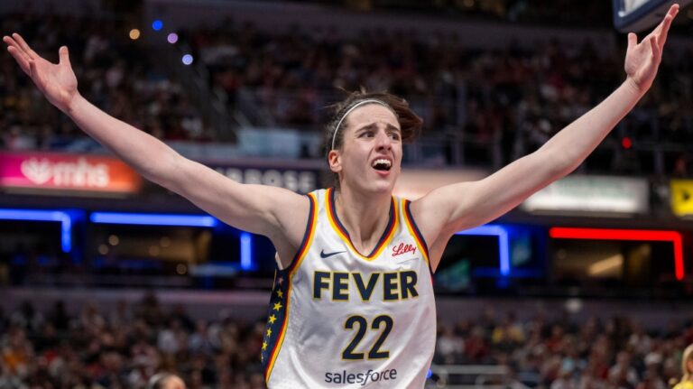 Indiana Fever guard Caitlin Clark reacts after scoring against the Seattle Storm on May 30, 2024. (Doug McSchooler/AP Photo)