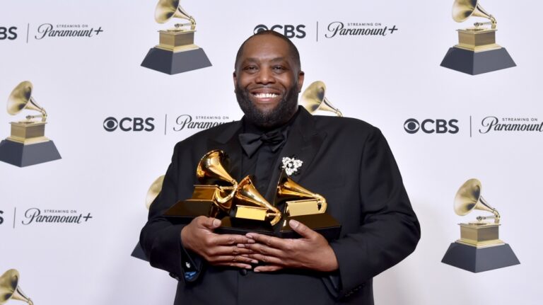 Killer Mike poses in the press room with the awards for best rap performance and best rap song for "Scientists & Engineers," and best rap album for "Michael" during the 66th annual Grammy Awards on Sunday, Feb. 4, 2024, in Los Angeles. (Photo by Richard Shotwell/Invision/AP)