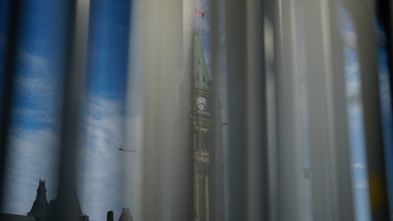 The Peace Tower is pictured through security fencing on Parliament Hill in Ottawa on Wednesday, June 19, 2024. THE CANADIAN PRESS/Sean Kilpatrick