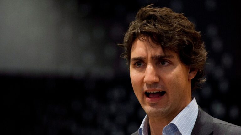 Liberal leadership candidate Justin Trudeau speaks with children and teachers after touring Leo Baeck Day School in Toronto on Tuesday, Nov. 6, 2012. (Nathan Denette/THE CANADIAN PRESS)