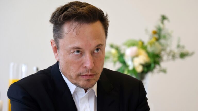 Twitter, now X. Corp, and Tesla CEO Elon Musk meets France's Finance Minister Bruno Lemaire, unseen, during the 6th edition of the "Choose France" summit, in Versailles, outside Paris, France, Monday, May 15, 2023. (Ludovic Marin/ Pool Photo via AP)