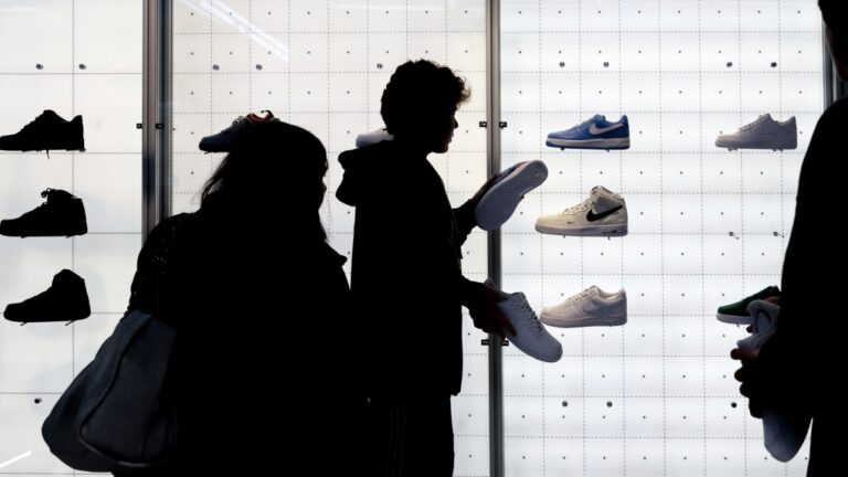 People shop for Nike shoes at a store on Nov. 25, 2022, in New York. (Julia Nikhinson / AP Photo, File)
