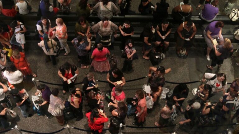 This June 28, 2011, file photo shows people waiting to attend an autograph signing event during the Romance Writers of America Annual Conference in New York. (AP Photo/Tina Fineberg, File)
