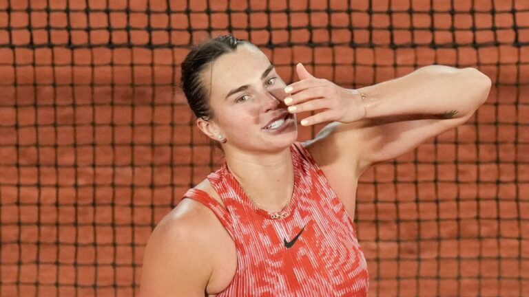 Aryna Sabalenka of Belarus blows a kiss to cheering tennis fans after winning her third round match of the French Open tennis tournament against Spain's Paula Badosa at the Roland Garros stadium in Paris, Saturday, June 1, 2024. (AP Photo/Christophe Ena)