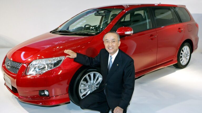 Toyota President Katsuaki Watanabe poses with Corolla Fielder during a press unveiling in Tokyo on Oct. 10, 2006. (AP Photo/Katsumi Kasahara, FILE)