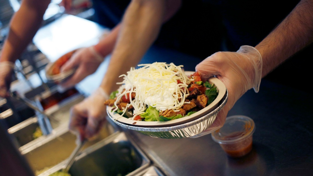 An employee prepares a burrito bowl at a Chipotle Mexican Grill Inc. restaurant in Louisville, Kentucky, in 2019. (Luke Sharrett / Bloomberg / Getty Images via CNN Newsource)