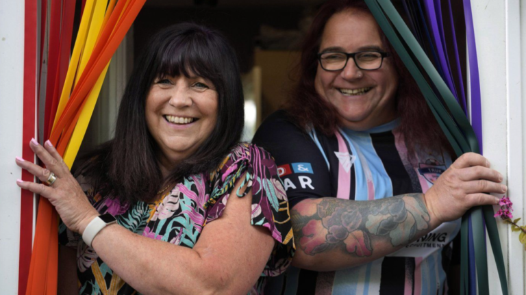 Avril Clark, left, and Lucy pose for a photograph during an interview at their house in London, Tuesday, June 11, 2024. (AP Photo/Kin Cheung)