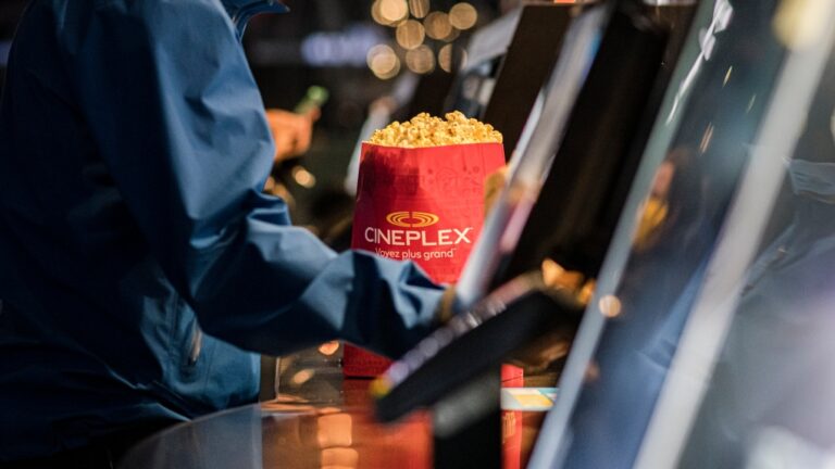 Customers buy popcorn at a Cineplex theatre in downtown Toronto on Wednesday, Aug. 26, 2020. (Christopher Katsarov / The Canadian Press)