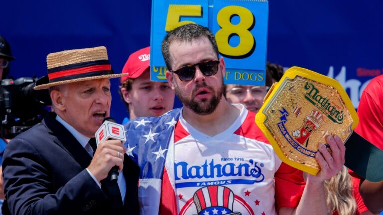 Patrick Bertoletti, right, reacts after winning the men's division in Nathan's Famous Fourth of July hot dog eating contest, Thursday, July 4, 2024, at Coney Island in New York. (Julia Nikhinson / AP Photo)
