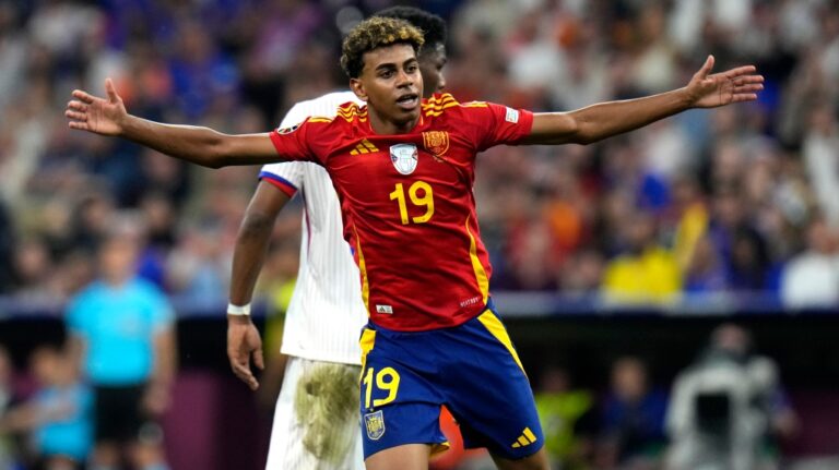 Spain's Lamine Yamal reacts during a semifinal match between Spain and France at the Euro 2024 soccer tournament in Munich, Germany, Tuesday, July 9, 2024. Left Spain's Rodri. (Hassan Ammar / AP Photo)