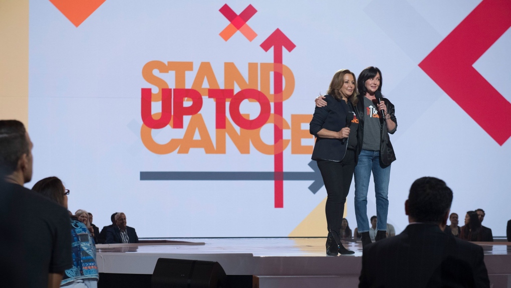 Deborah Waknin-Harwin and Shannen Doherty speak at a Stand Up To Cancer program in 2018. (Image Group LA/Getty Images via CNN Newsource)