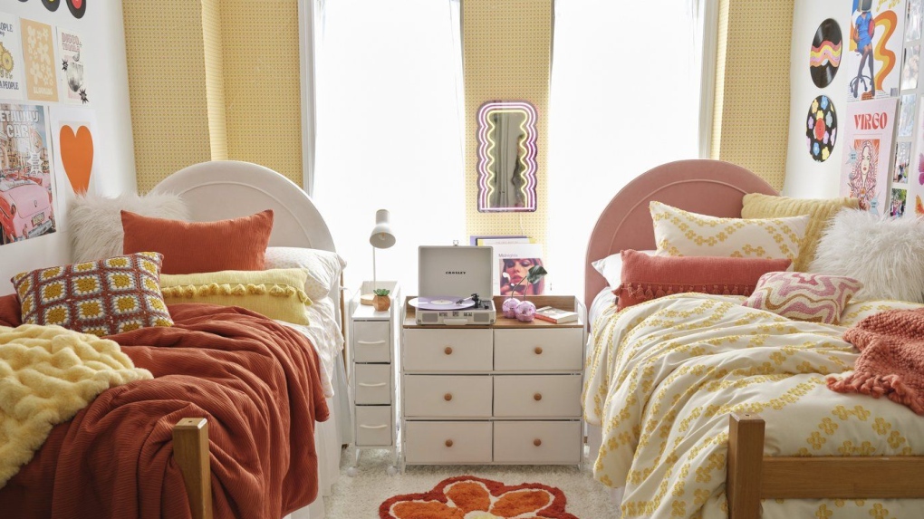 This image provided by Dormify shows a bedroom with two single beds. (Dormify via AP)