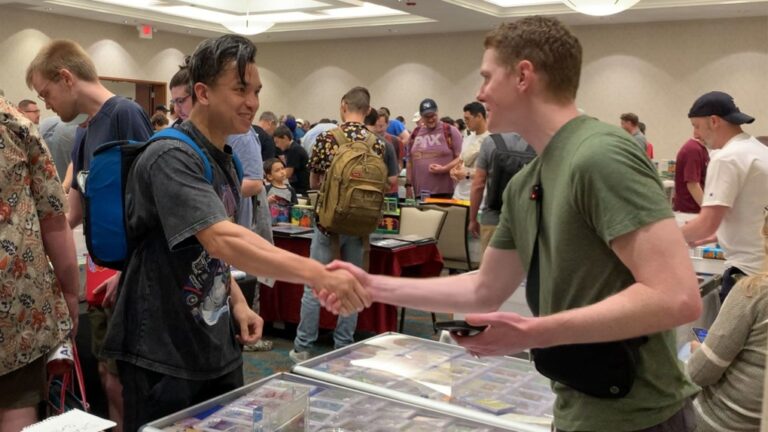 Ross "Coop" Cooper (right), a prolific collector of Pokémon cards, often ends up giving out cards for free at conventions he attends. The kids and adults he gifts cards to are often stupefied by his small but meaningful act of kindness. (Courtesy Coop's Collection via CNN Newsource)
