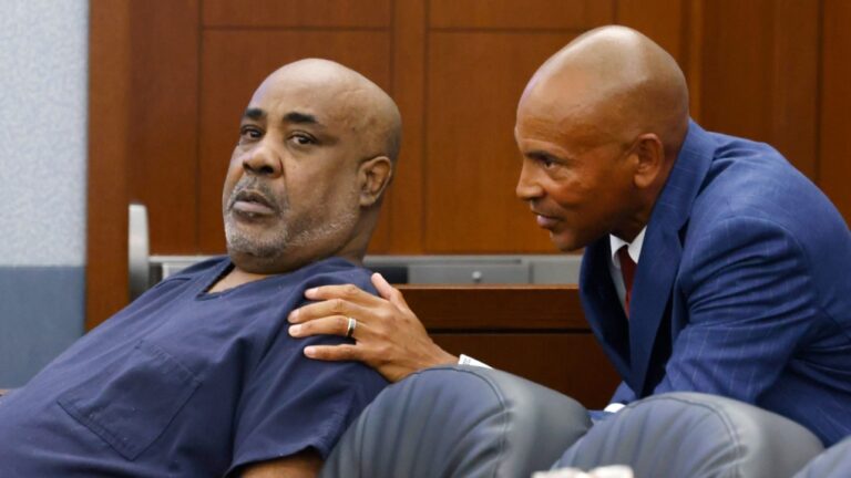 Duane "Keffe D" Davis, left, who is accused of orchestrating the 1996 slaying of hip-hop icon Tupac Shakur, listens to his attorney Carl Arnold during a hearing to reconsider his bond at the Regional Justice Center, July 23, 2024, in Las Vegas. (Bizuayehu Tesfaye/Las Vegas Review-Journal via AP)