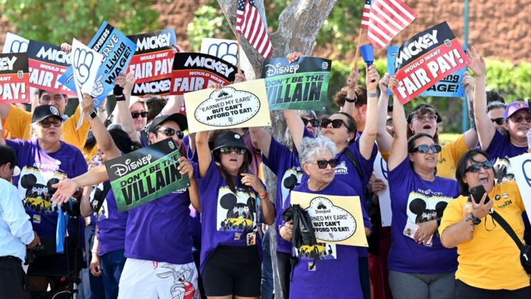 Disney employees rally outside the main entrance of Disneyland Resort in Anaheim, California, on July 17, 2024, ahead of the strike authorization vote prior to a tentative deal being struck on Tuesday. (Frederic J. Brown / AFP / Getty Images via CNN Newsource)