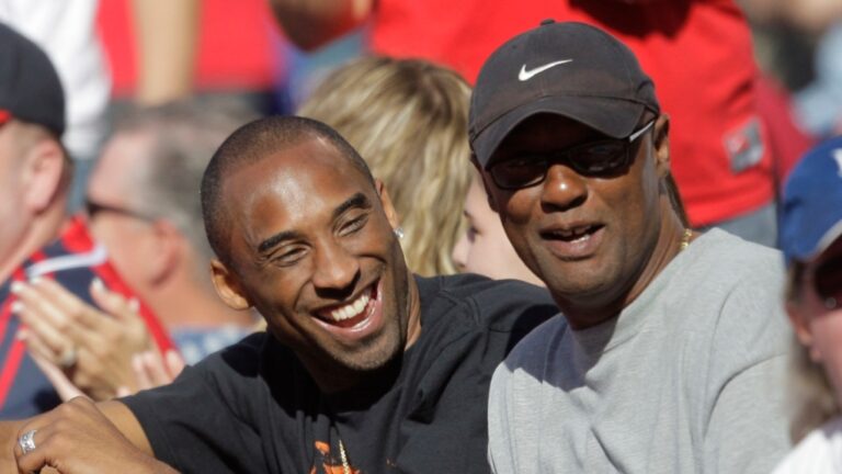 Los Angeles Lakers' Kobe Bryant, left, talks to his father, Joe, as they watch a baseball game between the Los Angeles Angels and the Los Angeles Dodgers in Anaheim, Calif., Sunday, June 21, 2009. (AP Photo/Jae C. Hong, File)