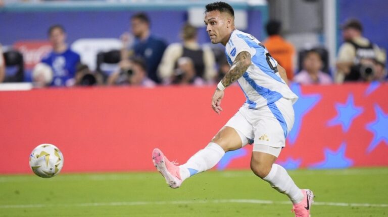 Argentina's Lautaro Martínez scores his side's first goal against Colombia during the Copa America final soccer match in Miami Gardens, Fla., Sunday, July 14, 2024. (Rebecca Blackwell/AP Photo)