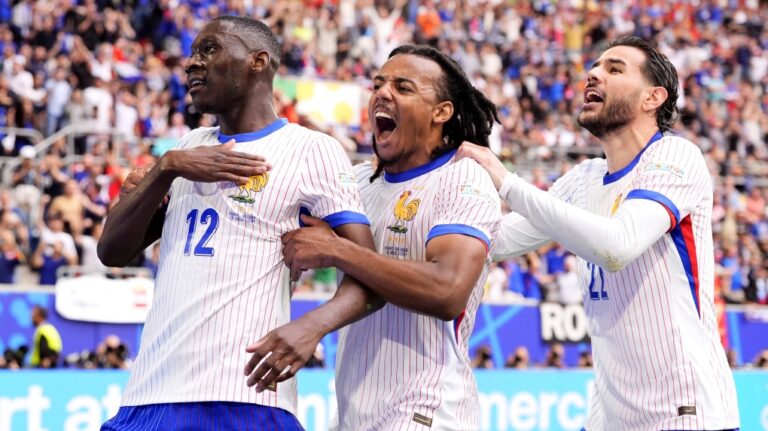 Randal Kolo Muani of France, left, and his teammates celebrate their side's first goal during a round of sixteen match between France and Belgium at the Euro 2024 soccer tournament in Duesseldorf, Germany, Monday, July 1, 2024. (Fabio Ferrari / LaPresse via AP)