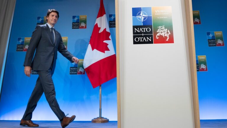Prime Minister Justin Trudeau walks to the podium for his a closing news conference following the NATO Summit in Vilnius, Lithuania, Wednesday, July 12, 2023. (Adrian Wyld / The Canadian Press)