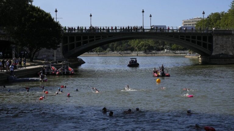 People swim in the Seine river after in Paris Mayor Anne Hidalgo swam in the river Wednesday, July 17, 2024 in Paris. (AP Photo/Michel Euler)