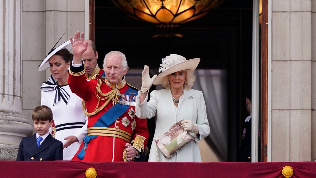 King Charles III, and Queen Camilla wave to the crowd from the balcony of Buckingham Palace after attending the Trooping the Color ceremony, in London, Saturday, June 15, 2024. (AP Photo/Alberto Pezzali)