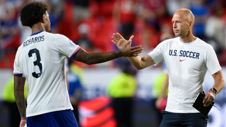 Coach Gregg Berhalter of the United States, right, greets his player Chris Richards after losing 0-1 against Uruguay at the end of a Copa America Group C soccer match in Kansas City, Mo., Monday, July 1, 2024. (Reed Hoffman / AP Photo)