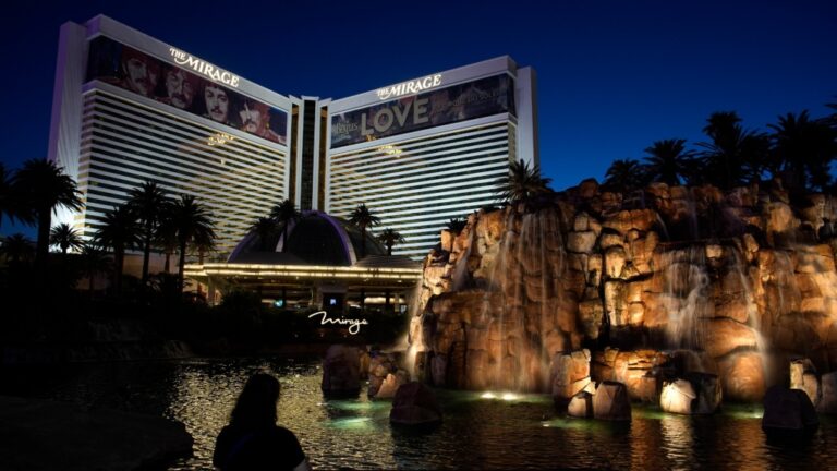 A person stands in front of the Mirage hotel-casino along the Las Vegas Strip, May 16, 2024, in Las Vegas. (AP Photo/John Locher)