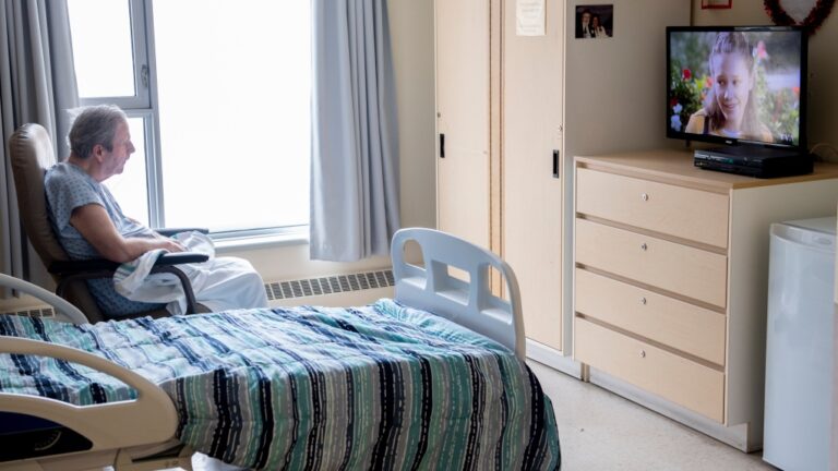 A resident sits in his room at a long-term care home in Laval, Que., Friday, February 25, 2022. THE CANADIAN PRESS/Graham Hughes