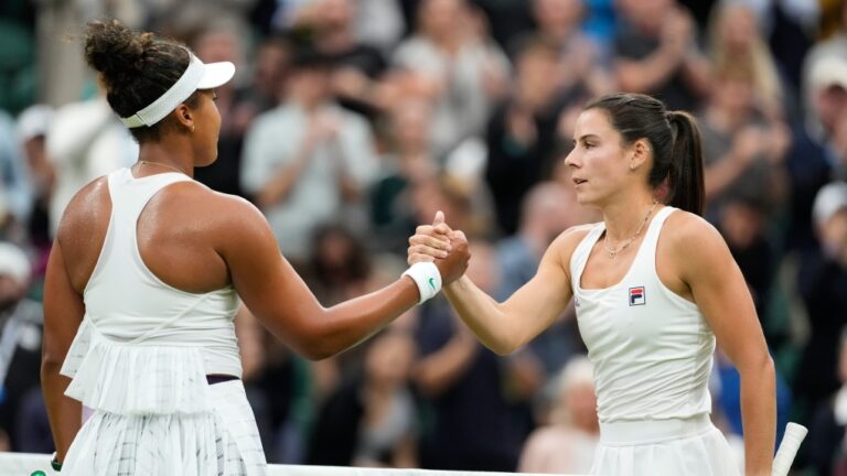 Emma Navarro, right, of the United States is congratulated by Naomi Osaka of Japan following their match on day three at the Wimbledon tennis championships in London, Wednesday, July 3, 2024. (AP Photo/Alberto Pezzali)