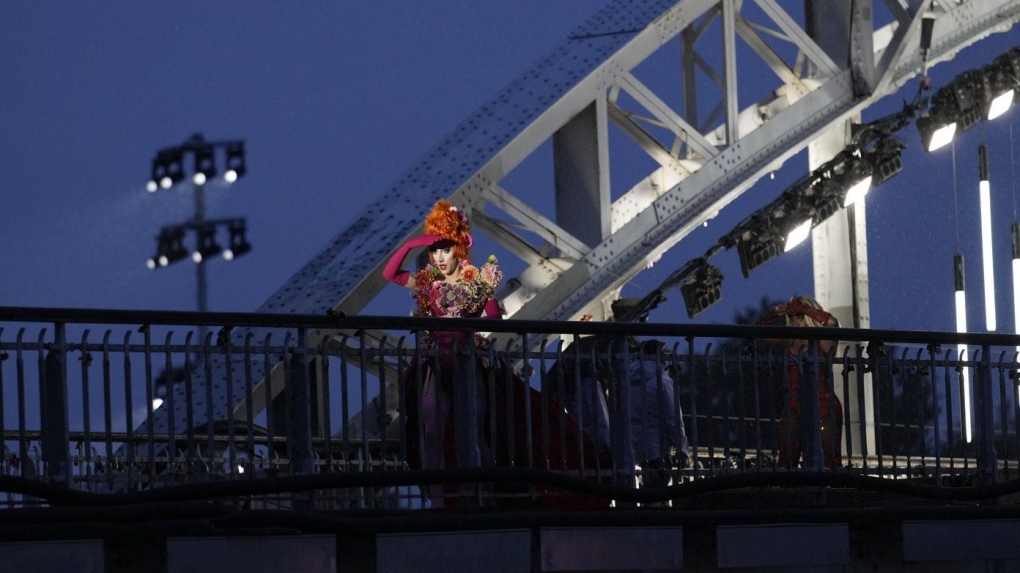 Drag queens prepare to perform on the Debilly Bridge in Paris, during the opening ceremony of the 2024 Summer Olympics, Friday, July 26, 2024. (AP Photo/Tsvangirayi Mukwazhi)