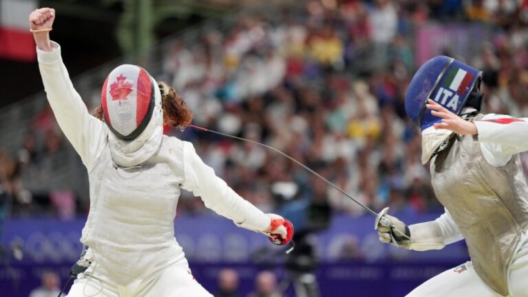Eleanor Harvey, of Canada, celebrates her win over Martina Favaretto, of Italy, in the women's individual foil in Paris, France on Sunday, July 28, 2024. (Christinne Muschi/The Canadian Press)