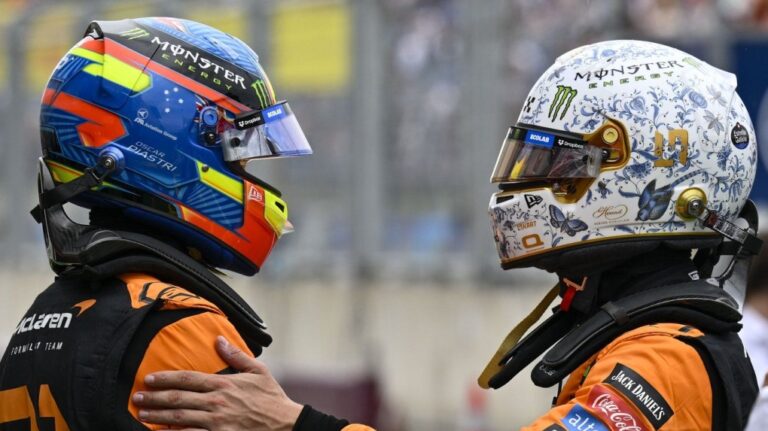 McLaren driver Lando Norris of Britain, right, shakes hands with McLaren driver Oscar Piastri of Australia after setting the pole position in the qualifying session ahead of Sunday's Formula One Hungarian Grand Prix auto race, at the Hungaroring racetrack in Mogyorod, near Budapest, Hungary, Saturday, July 20, 2024. (AP Photo/Denes Erdos)