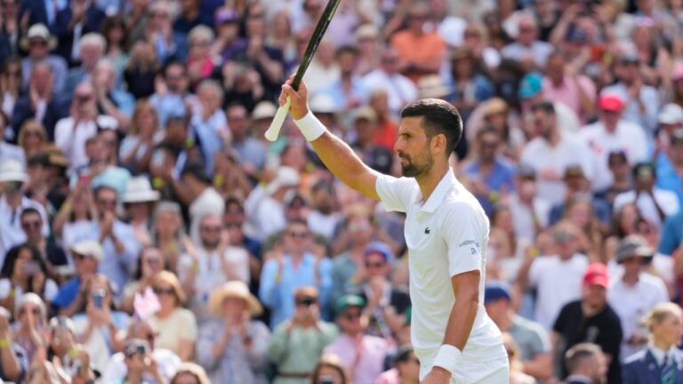 Serbia's Novak Djokovic waves after defeating Britain's Jacob Fearnley in their second round match at the Wimbledon tennis championships in London, Thursday, July 4, 2024. (AP Photo/Kirsty Wigglesworth)