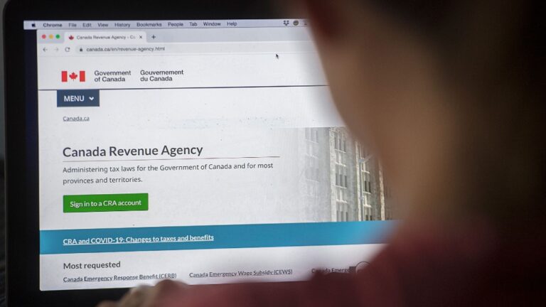A person looks at a Canada Revenue Agency homepage in Montreal, Sunday, August 16, 2020. (Graham Hughes/The Canadian Press)