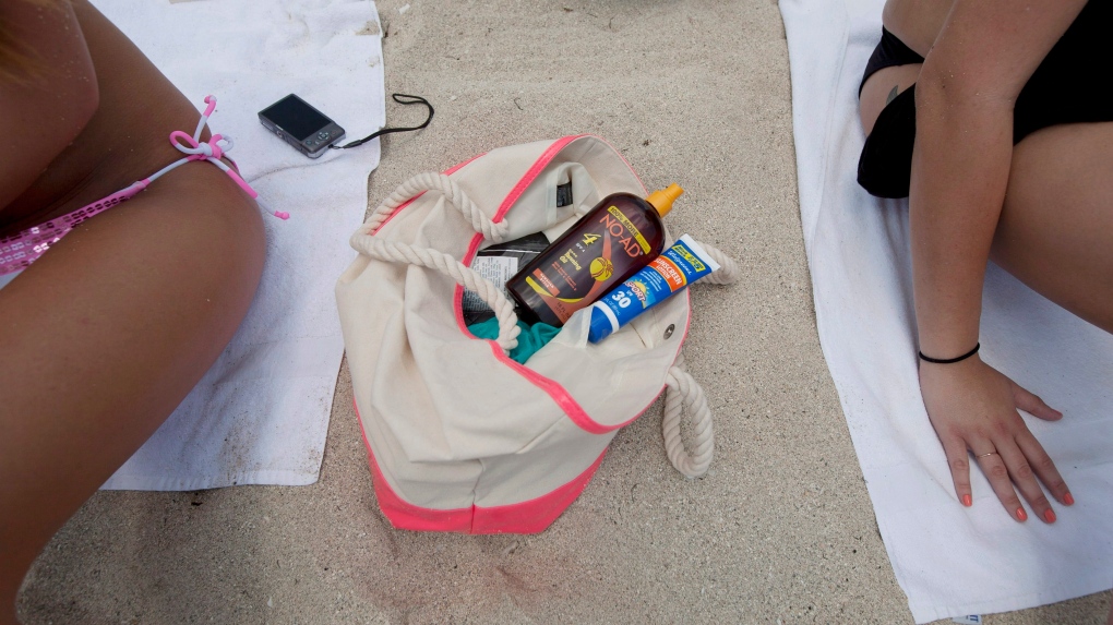Women sunbathe in Miami Beach, Fla., on May 9, 2012. (J Pat Carter / AP Photo)