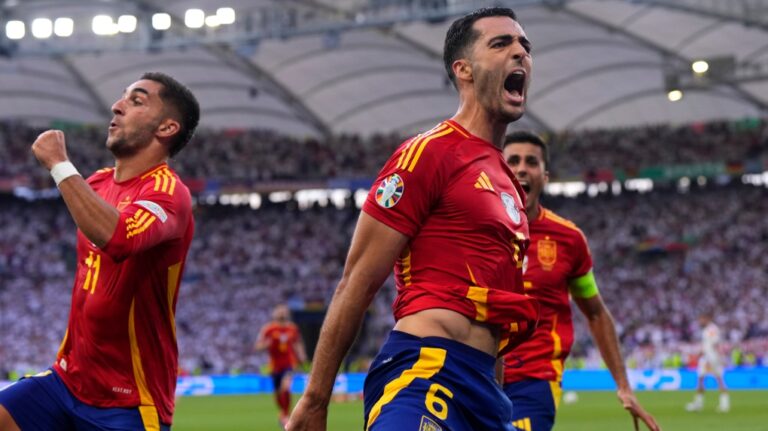 Spain's Mikel Merino, right, celebrates with Spain's Ferran Torres after scoring his sides second goal during a quarter final match between Germany and Spain at the Euro 2024 soccer tournament in Stuttgart, Germany, Friday, July 5, 2024. (Manu Fernandez / AP Photo)