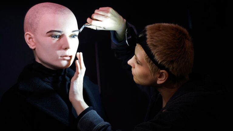 In this undated handout photo provided by The National Wax Museum Plus, Artistic Coordinator Mel Creek applies the finishing touches on a wax figure of the late singer Sinead O'Connor, at the National Wax Museum Plus on Dublin's Westmorland Street, Ireland. (Julien Behal via AP)