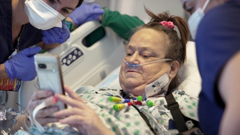 Lisa Pisano looks at photos of her dog after her surgeries at NYU Langone Health in New York on Monday, April 22, 2024. (Shelby Lum / AP Photo, File)