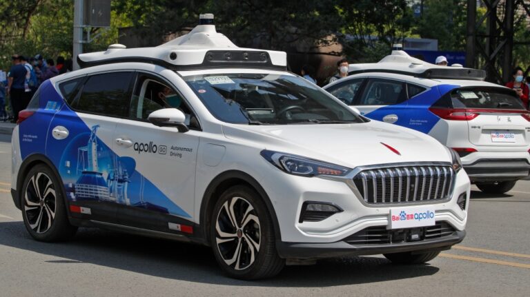 Baidu Apollo Robotaxis move on a street at the Shougang Park in Beijing, May 2, 2021. (AP Photo/Andy Wong)