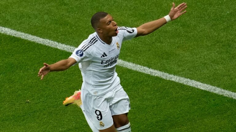 Real Madrid's Kylian Mbappe celebrates after scoring his side's second goal during the UEFA Super Cup Final soccer match between Real Madrid and Atalanta at the Narodowy stadium in Warsaw, Poland, Wednesday, Aug. 14, 2024. (Darko Vojinovic / AP Photo)