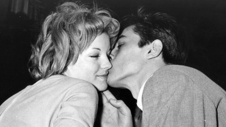 Romy Schneider is kissed by French actor Alain Delon in Morcote near Lugano, Switzerland, after their engagement on March 22, 1959. (AP Photo, File)