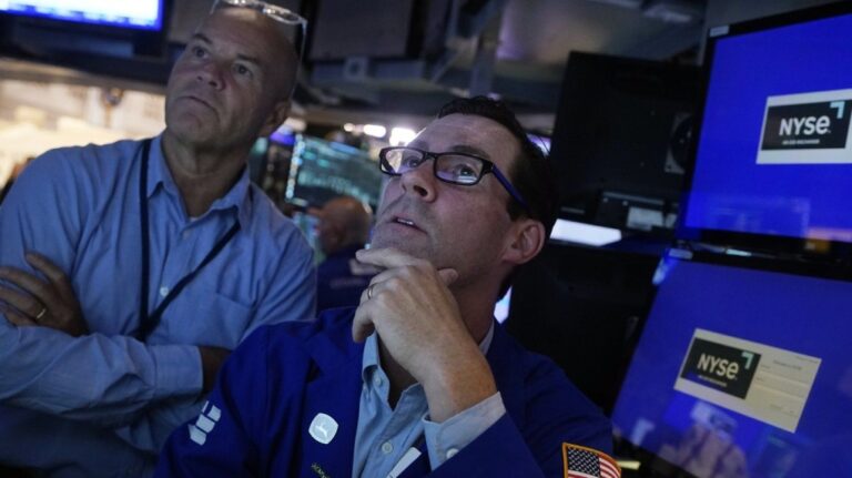 FILE - Specialist John McNierney, right, works with a colleague on the floor of the New York Stock Exchange, Aug. 7, 2024. (AP Photo/Richard Drew, File)