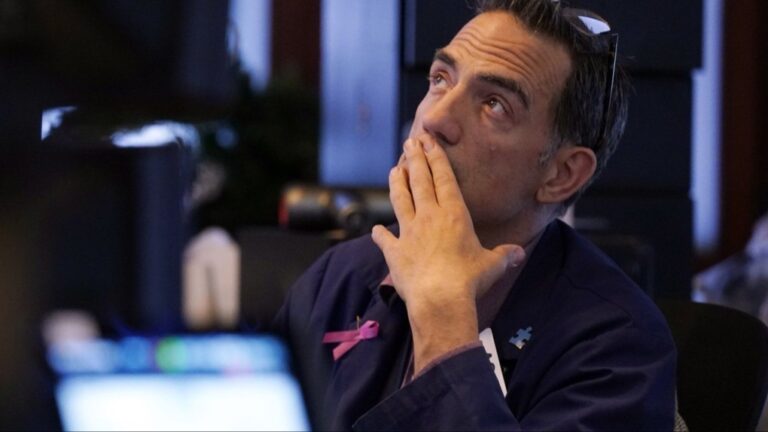 Trader Gregory Rowe works on the floor of the New York Stock Exchange, Monday, Aug. 5, 2024. (AP Photo/Richard Drew)