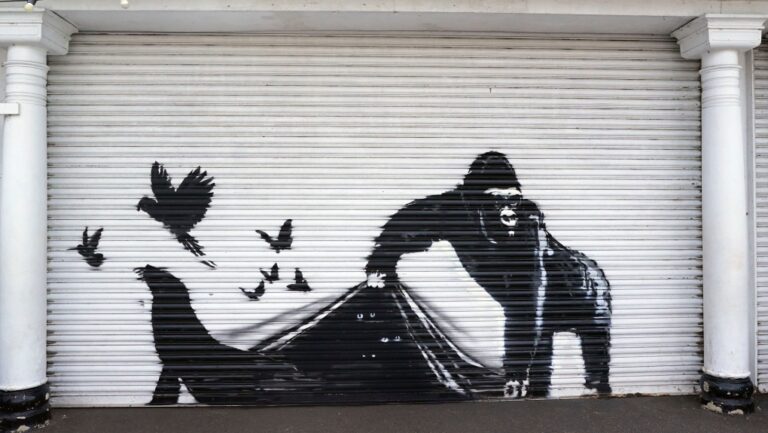 A new mural by elusive street artist Banksy is seen at the London Zoo, Tuesday, Aug. 13, 2024, in London. (Stefan Rousseau/PA via AP)